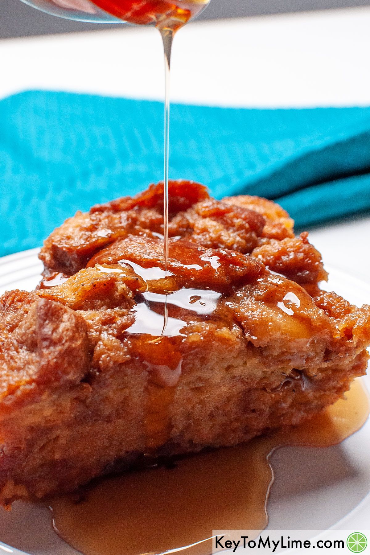 Pour syrup into a serving of Crockpot French toast casserole.
